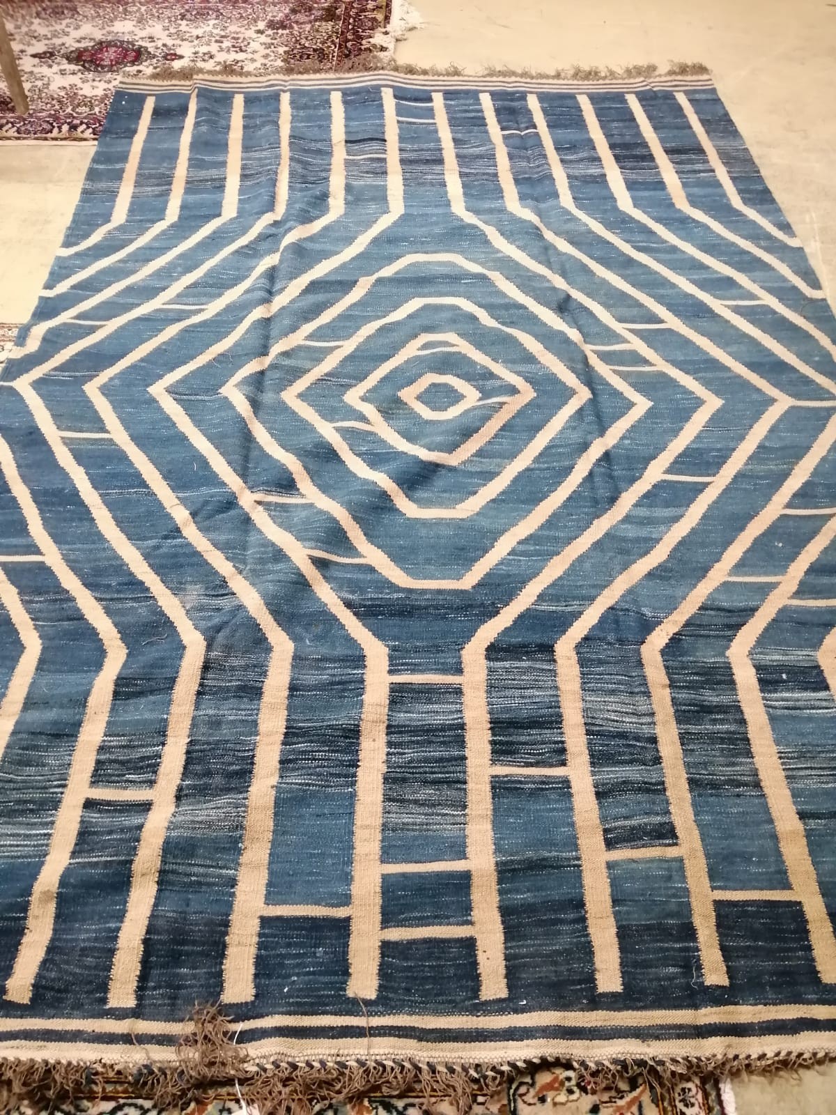 A Kilim blue ground carpet designed by Romeo Gigli, 300 x 209cm